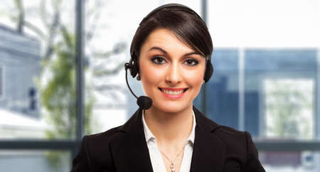 Portrait of a beautiful customer representative at workの写真素材