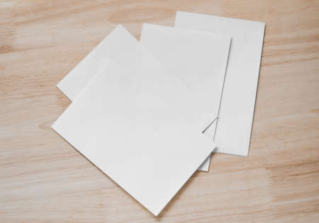 Top view of blank business cards isolated on wood background. Poster mock-ups paper, white paper...