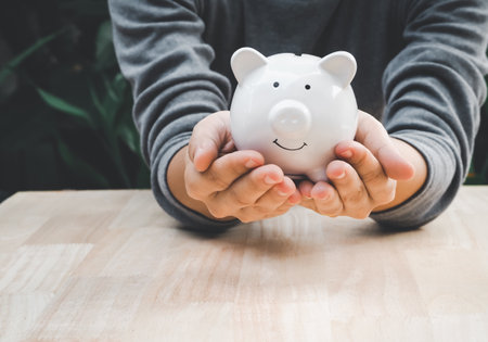 piggy bank in hand, The concept of saving money or savings, investmentの写真素材