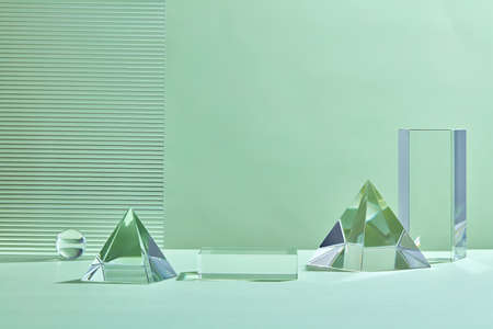 Empty podium for product display. Monochrome Pedestal with ribbed. Glass Abstract background with in pastel green color for product cosmetics presentation.の写真素材
