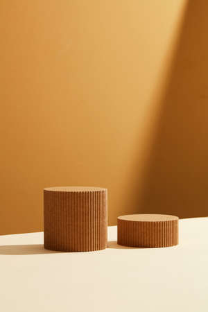 Abstract background for branding and minimal presentation. Glass podium on folding paper pleated geometric pink backgroundの写真素材