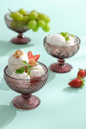 Ice cream with fresh fruits on Mint table. Image for menu.の写真素材
