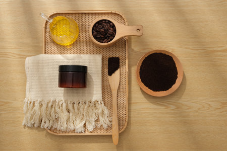 On the wooden background, a tray container cosmetic jar unlabeled, bowl and spoon of coffee, cup of...