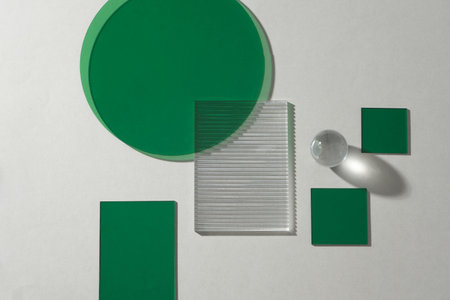 Top view of transparent cuboids, crystal ball and green geometric shapes. Background for the presentation productsの写真素材