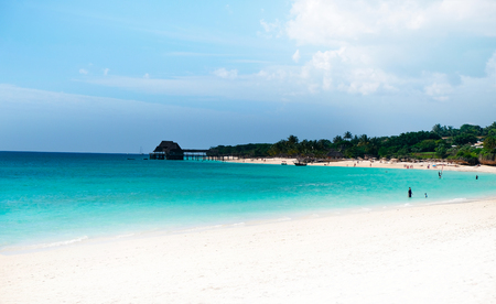Beautiful view of the ocean and the coastline. People rest on the beach. The coast of the Indian Ocean. Zanzibar of Tanzaniaの写真素材