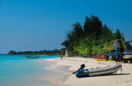 Beautiful view of the ocean and the coastline. People rest on the beach. The coast of the Indian Ocean. Zanzibar of Tanzaniaの写真素材