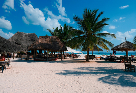 Beautiful view of the beach with white sand. People rest on the coast of the Indian Ocean. Zanzibar of Tanzaniaの写真素材