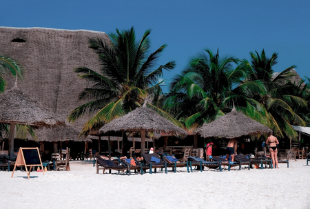 Beautiful view of the beach with white sand. People rest on the coast of the Indian Ocean. Zanzibar of Tanzaniaの写真素材