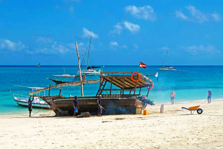 Kendwa, Zanzibar - July 12, 2018: Ship repair on the beachのeditorial素材