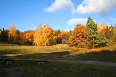 Ancient rural church in the autumn landscapeの写真素材