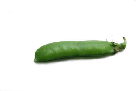 Peas over the white. Still life
