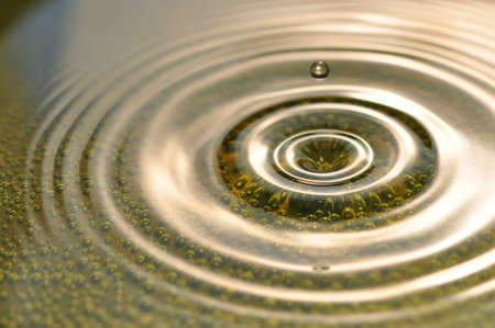 Macro photo water ripple with green bubbles in the waterの写真素材