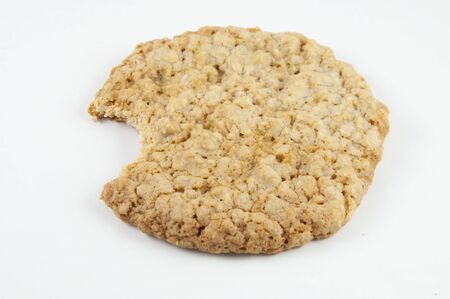 An oatmeal cookie isolated on whiteの写真素材