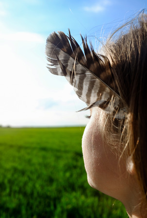 Girl with the featherの写真素材