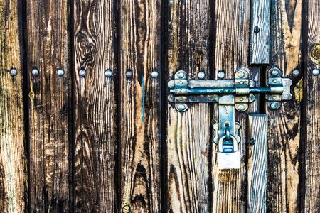 Lock on the wooden gate