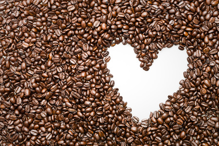 White heart symbol in coffee beans
