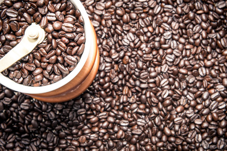 Coffee grinder on top of the coffee seeds