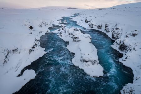 Photo of a river coming from Godafoss waterfallの写真素材