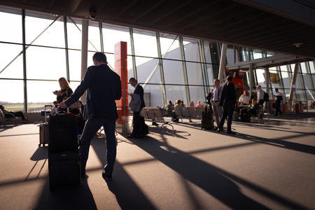 People waiting at their gate at the airport