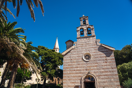 Budva is a town in Montenegro on the Adriatic Sea. Part of the Budva Riviera, it's known for sandy beaches and nightlife. Stone walls built by the Venetians surround the narrow streets of the medieval old town (Stari Grad).の写真素材