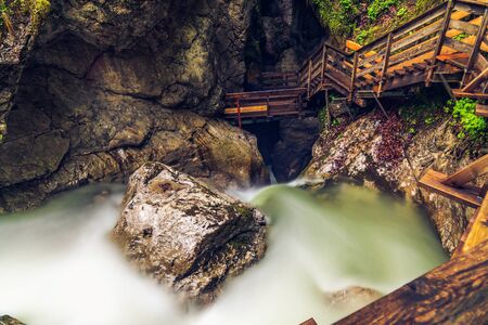Stairs in the Seisenbergklamm gorge. Natural wonder including huge caverns, deep gorge with rapids and wood walkways.の写真素材