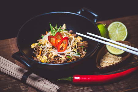 Noodles in bowl on wood table topの写真素材