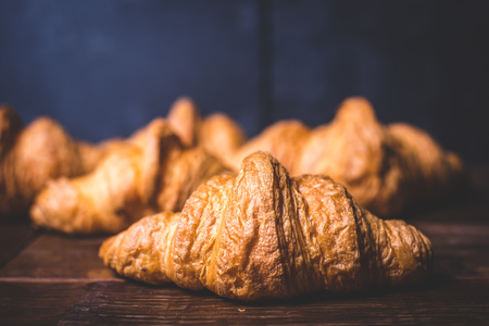 Croissant close-up on a blue background.の写真素材