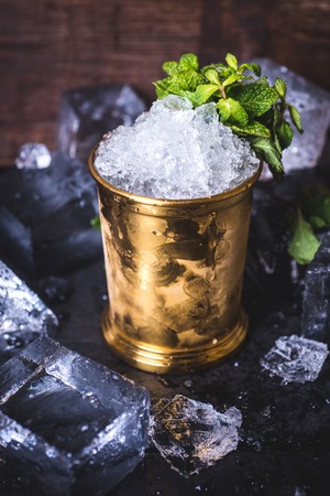 The ice in the tin can is decorated with mint.の写真素材