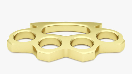 Gold Knuckle duster in a white studio environment.の写真素材