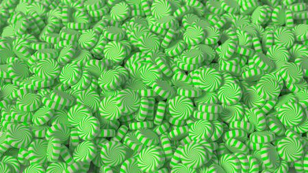 Large pile of green and white, pepperming swirl hard candy. This image is a 3D Illustration.の写真素材