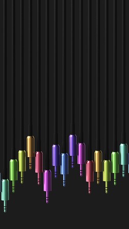 Line of metal 3.5mm audio jacks in various colours with a simple black background. This image is a...