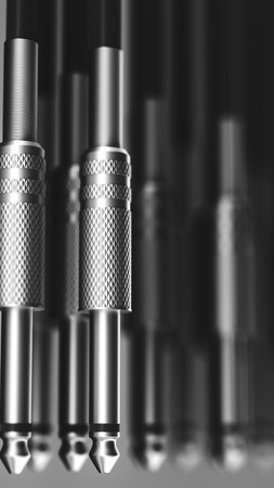 Macro image of a parallel arrangement of 6mm audio connections with a shallow depth of field. This...