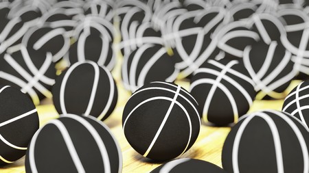 Neatly spaced array of white on black basketballs on a court surface and featuring a shallow depth of field. This image is a 3d rendering.の写真素材