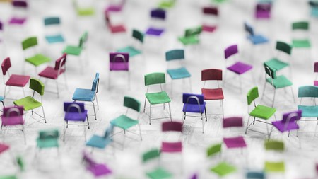 Shallow depth of field image of variously arranged steel and colorfully stained leather chairs on a colorless wood tile pattern floor. This image is a 3d render.の写真素材