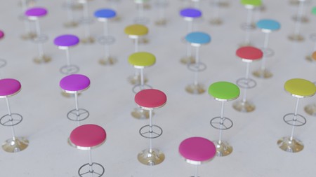 Array of variously colored covered bar stools on an infinite white concrete plane. This image features a shallow depth of field and is a 3d render.の写真素材