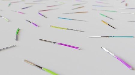 Neat uniform array of variously coloured Straight Razors under clean studio lighting. This image is...