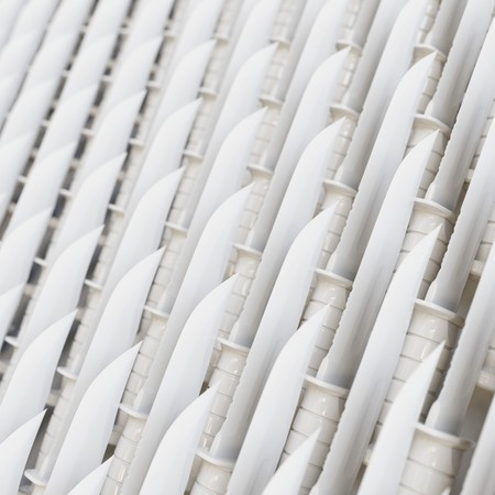 Isolated infinite array of densely packed Plastic Toy Hunting Knives presented with a shallow depth of field. This image is a 3d illustration.の写真素材