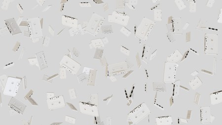 Numerous floating white cassette tapes at varying angles on a blank white background. This image is a 3d rendering.の写真素材