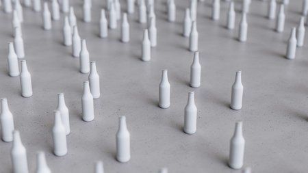 Large scattered array of white opaque longneck bottles arranged on a minimally textured white concrete surface. This image is a 3d rendering.の写真素材