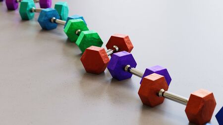 Neat line of variously oriented dumbells on a modern minimalistic neutral surface. This image is a 3d rendering.の写真素材