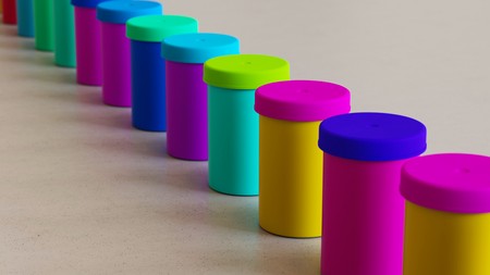 Neat line of variously oriented film containers on a modern minimalistic neutral surface. This image is a 3d rendering.の写真素材