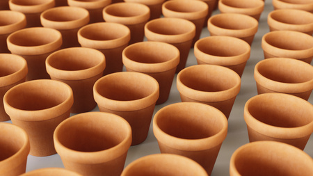 Tightly packed, uniform grid of orange terracotta pots under even studio lighting. This image is a 3d renderingの写真素材