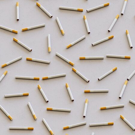 Perfect grid of cigarettes presented with even studio lighting and smooth depth of field. This image...