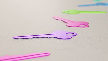 Neat line of variously oriented house keys on a modern minimalist neutral surface. This image is a 3d rendering.の写真素材
