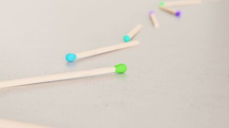 Neat line of variously oriented matchsticks on a modern minimalist neutral surface. This image is a 3d rendering.の写真素材