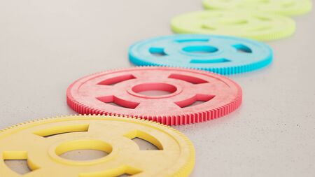 Neat line of variously oriented gears on a modern minimalist neutral surface. This image is a 3d rendering.の写真素材