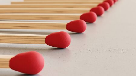 Close up on a tightly packed, perfectly aligned linear array of variously colored matchsticks on a simple modernist neutral surface. This image is a 3d render.の写真素材