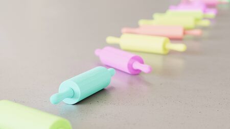 Neat line of variously oriented rolling pins on a modern minimalist neutral surface. This image is a...