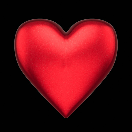Floating love heart isolated on a black background for easy compositing. This image is a 3d render.の写真素材