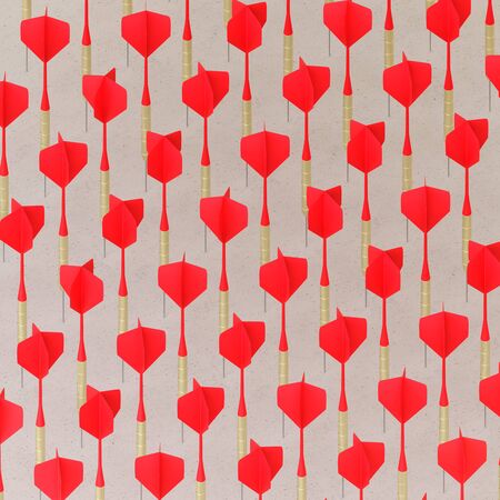 Isometric Red Playing Darts in a Tight Grid on a Simple Concrete Surfaceの写真素材